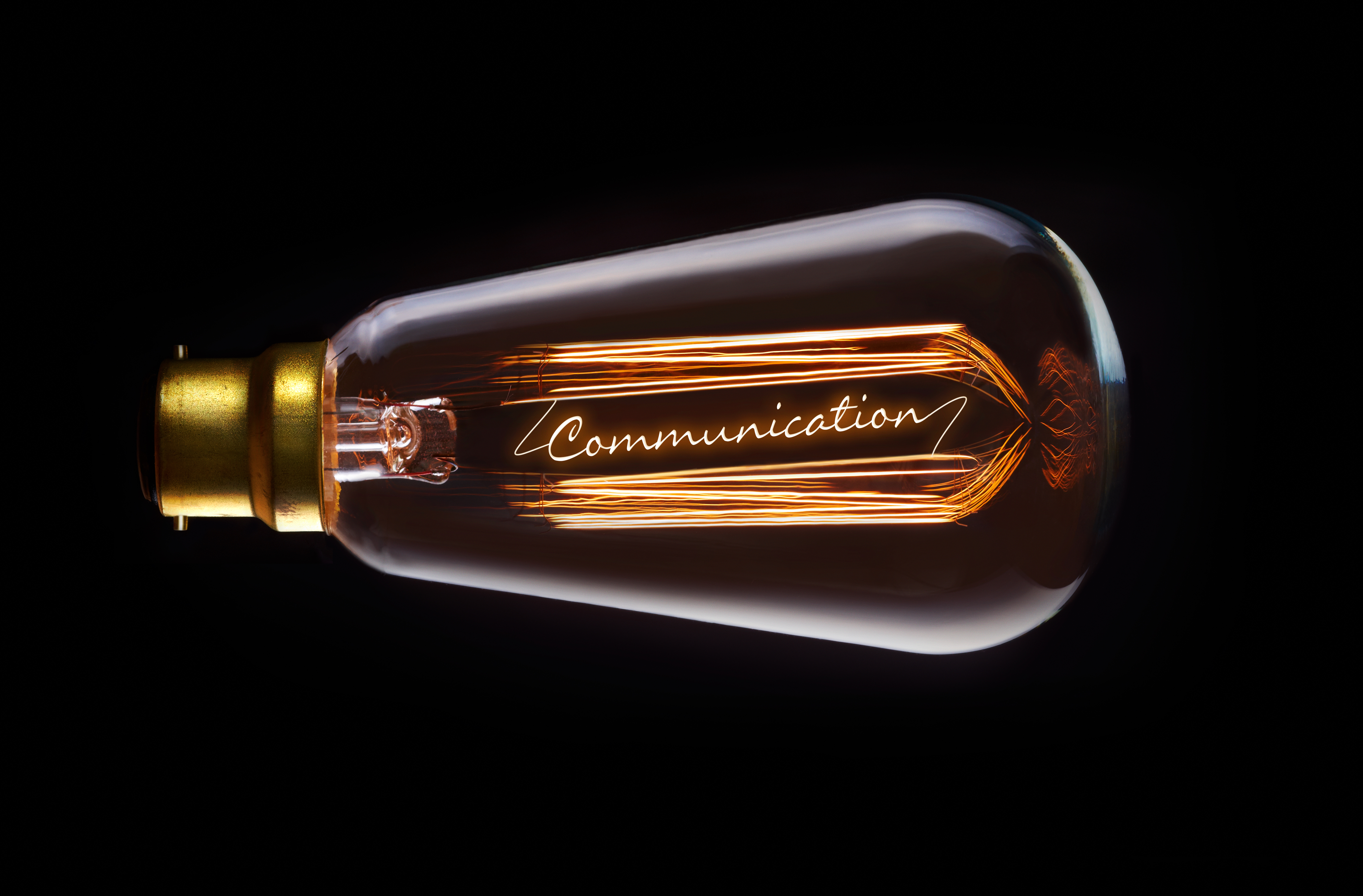 A light bulb with the word communication within it.